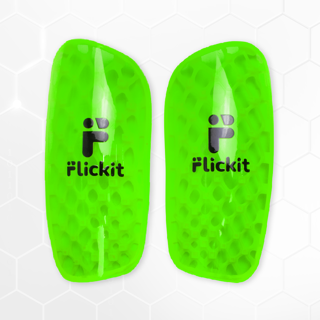 Pair of green soccer shin guards with 'Flickit' branding on a white background