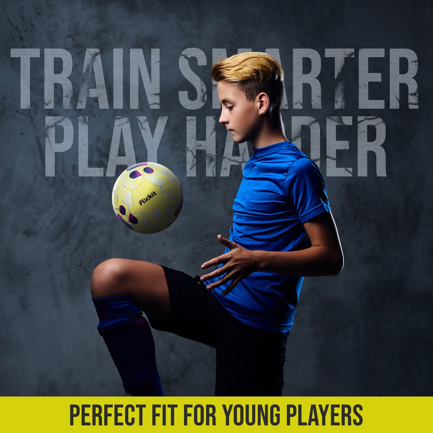 Young soccer player in blue uniform kicking a yellow soccer ball against a dark background with motivational text.