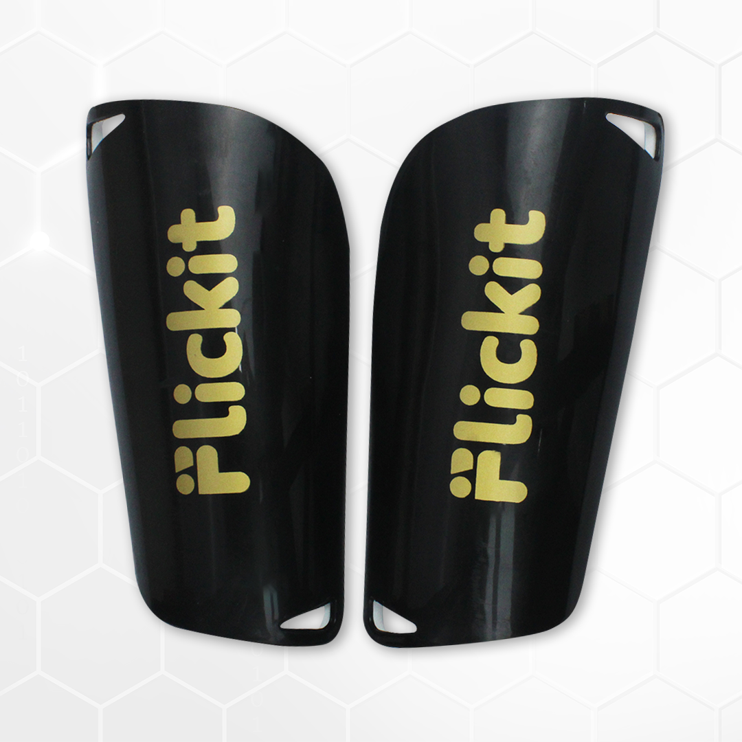 Black shin guards with 'Flickit' branding on a white background