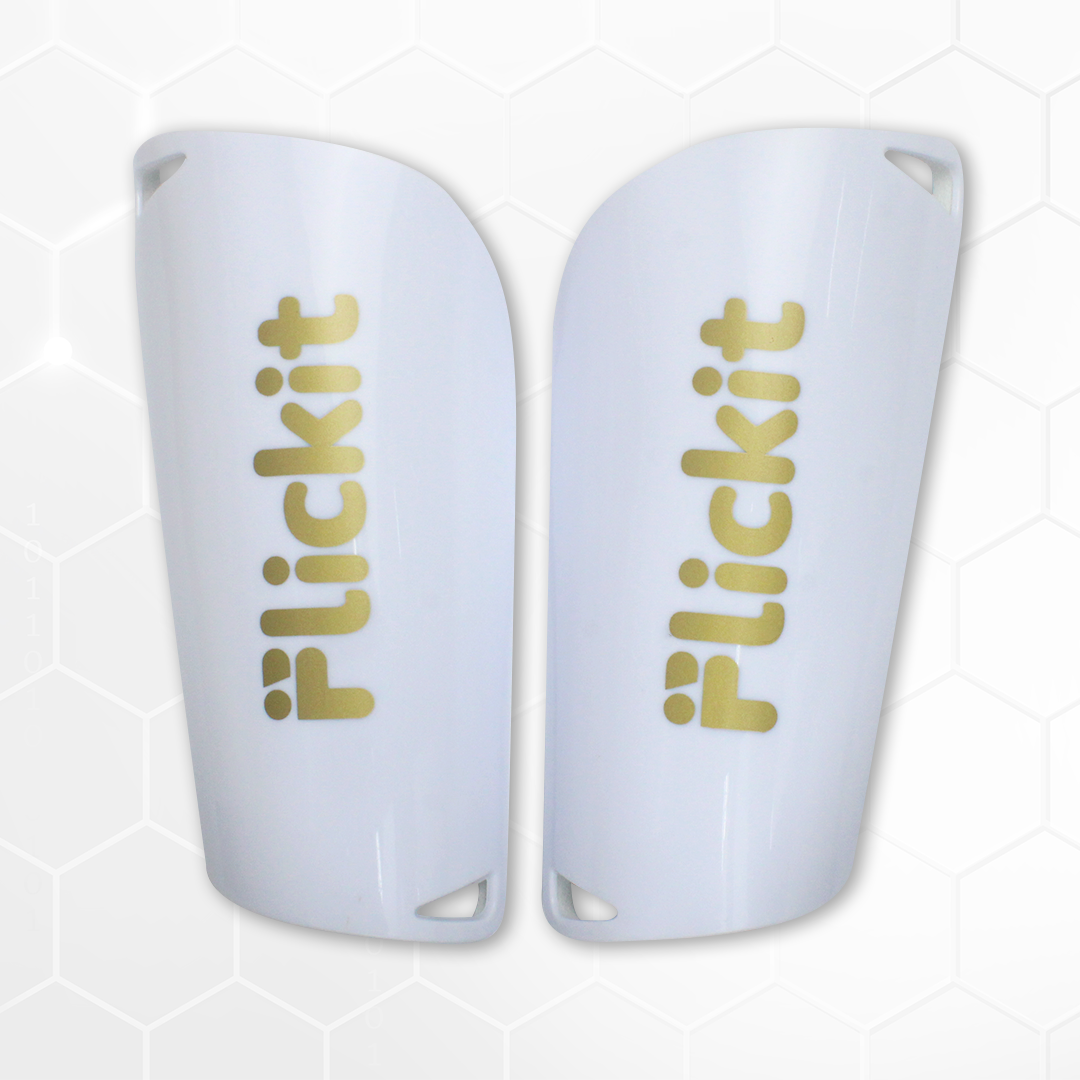 White shin guards with 'Flickit' branding on a light gray background