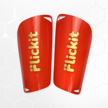 Red shin guards with 'Flickit' branding on a white background