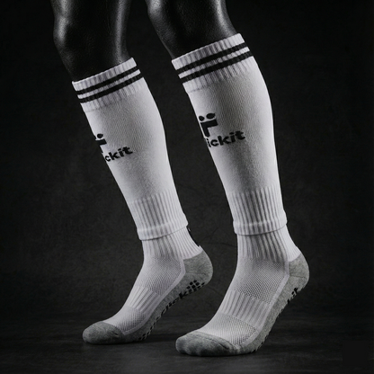 Flickit White knee-high socks with black stripes and branding on a dark background